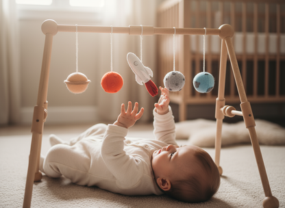 Baby playing with a wooden baby gym in a nursery
