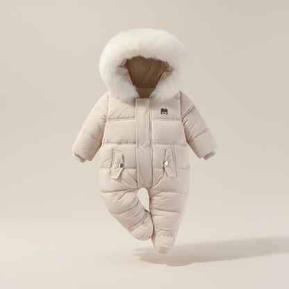 Beige baby snowsuit with fur hood on a beige background