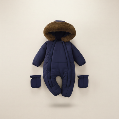 Navy blue baby snowsuit with brown fur hood on a beige background