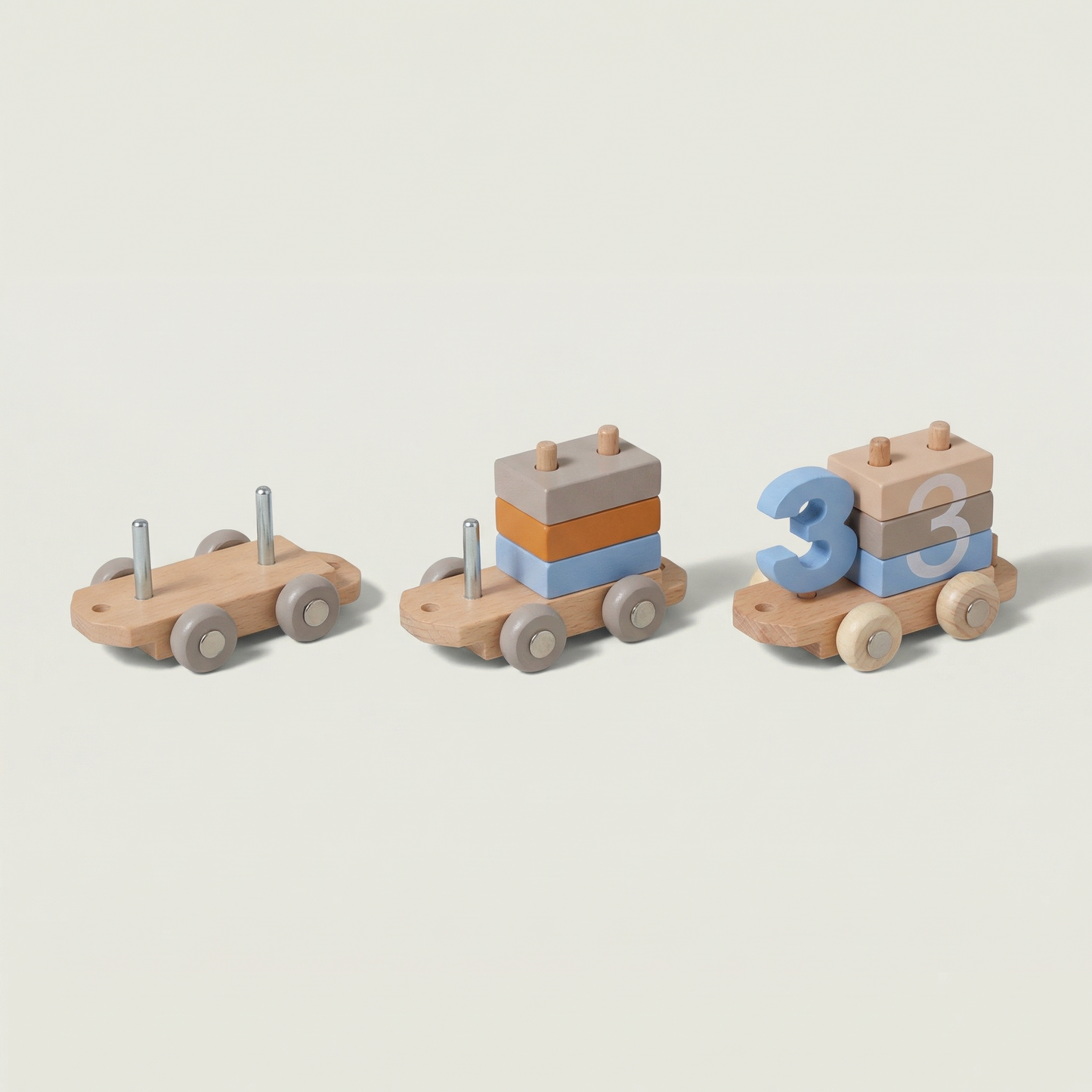 Set of three wooden toy cars with different designs on a light gray background