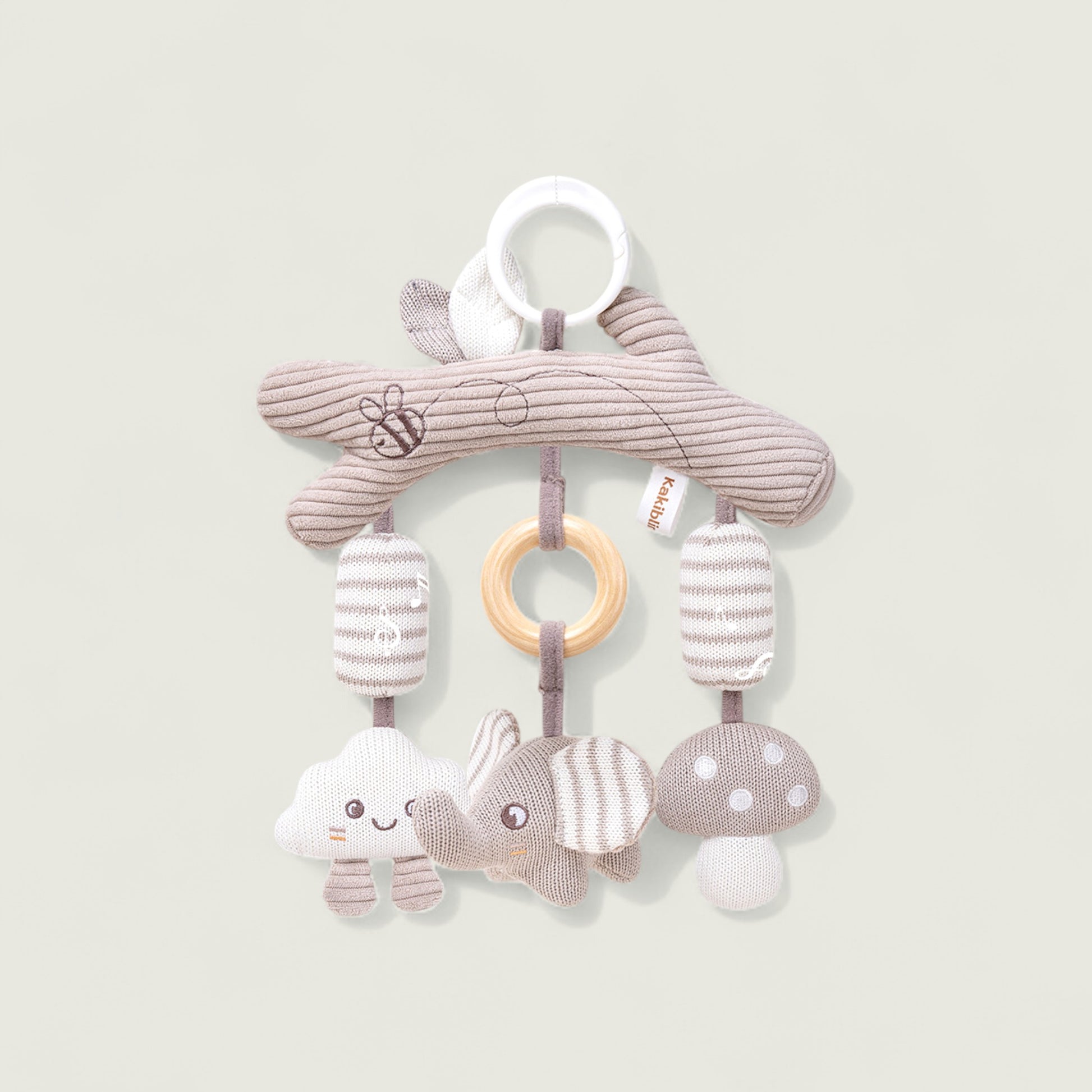 Baby mobile toy with soft animals and rings on a light background