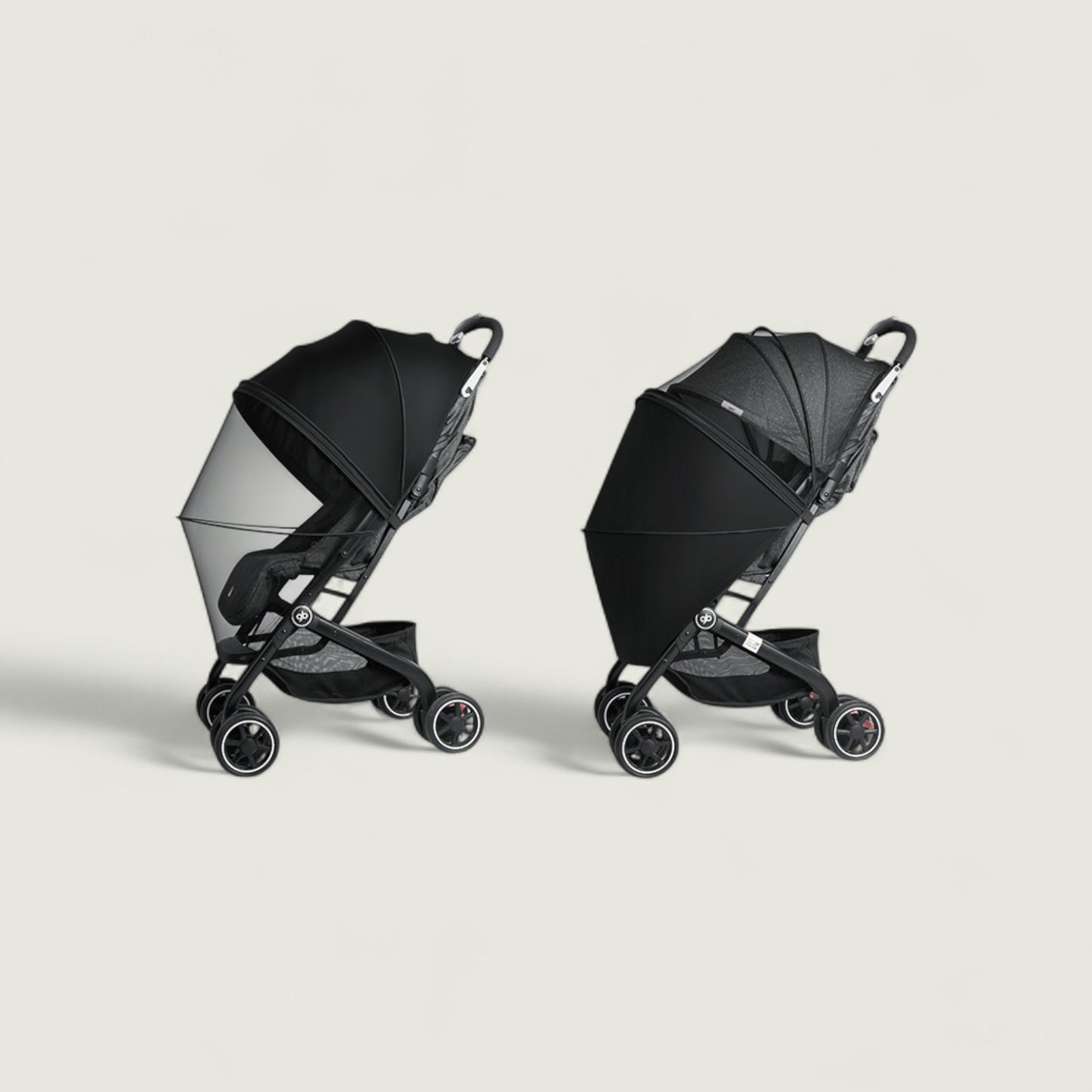 Two black strollers on a light gray background