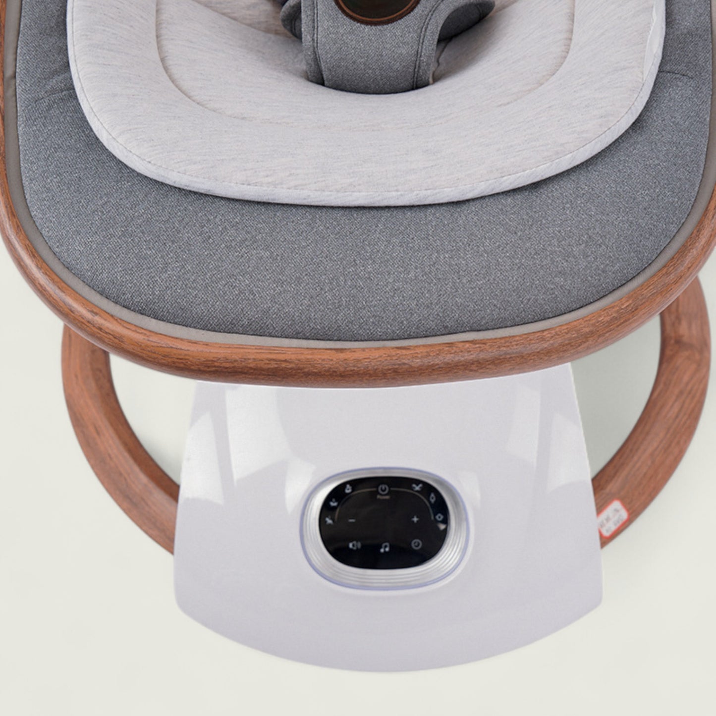 Modern chair with gray cushion and wooden frame on a light background