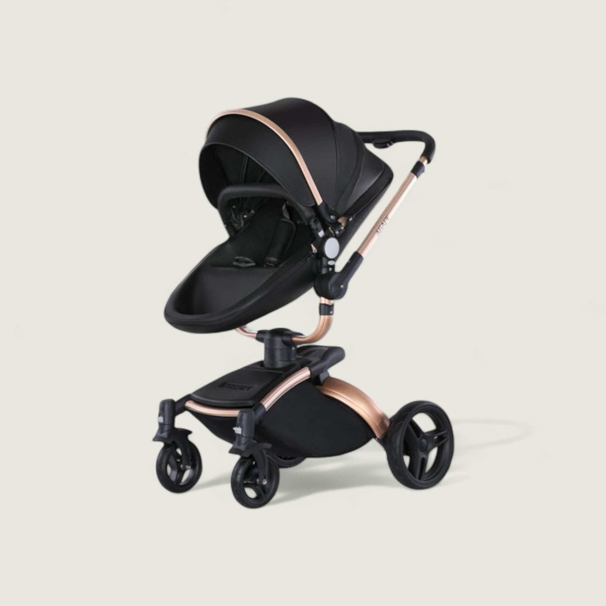 Black and rose gold stroller on a light beige background