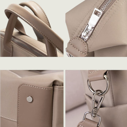 Close-up details of a beige handbag including handle, zipper, and clasp.