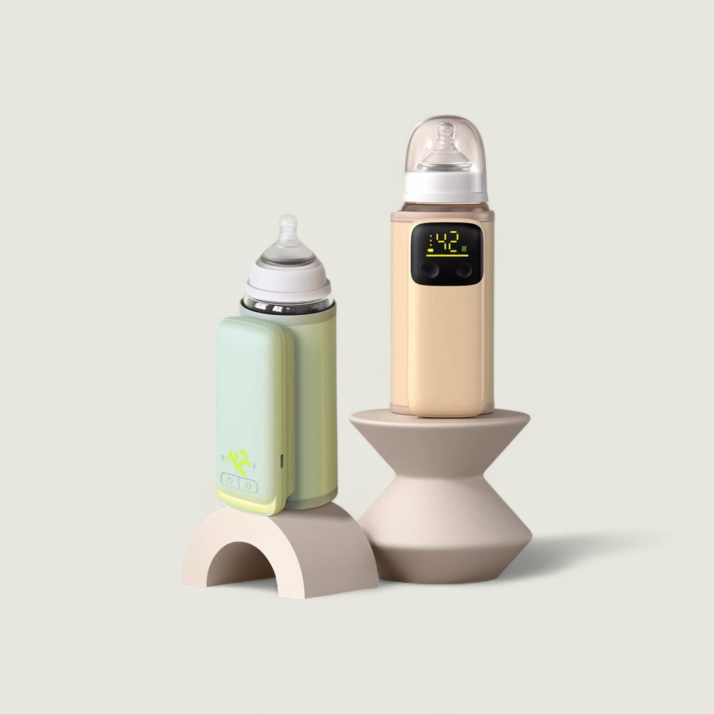Two baby bottles with digital displays on a light gray background