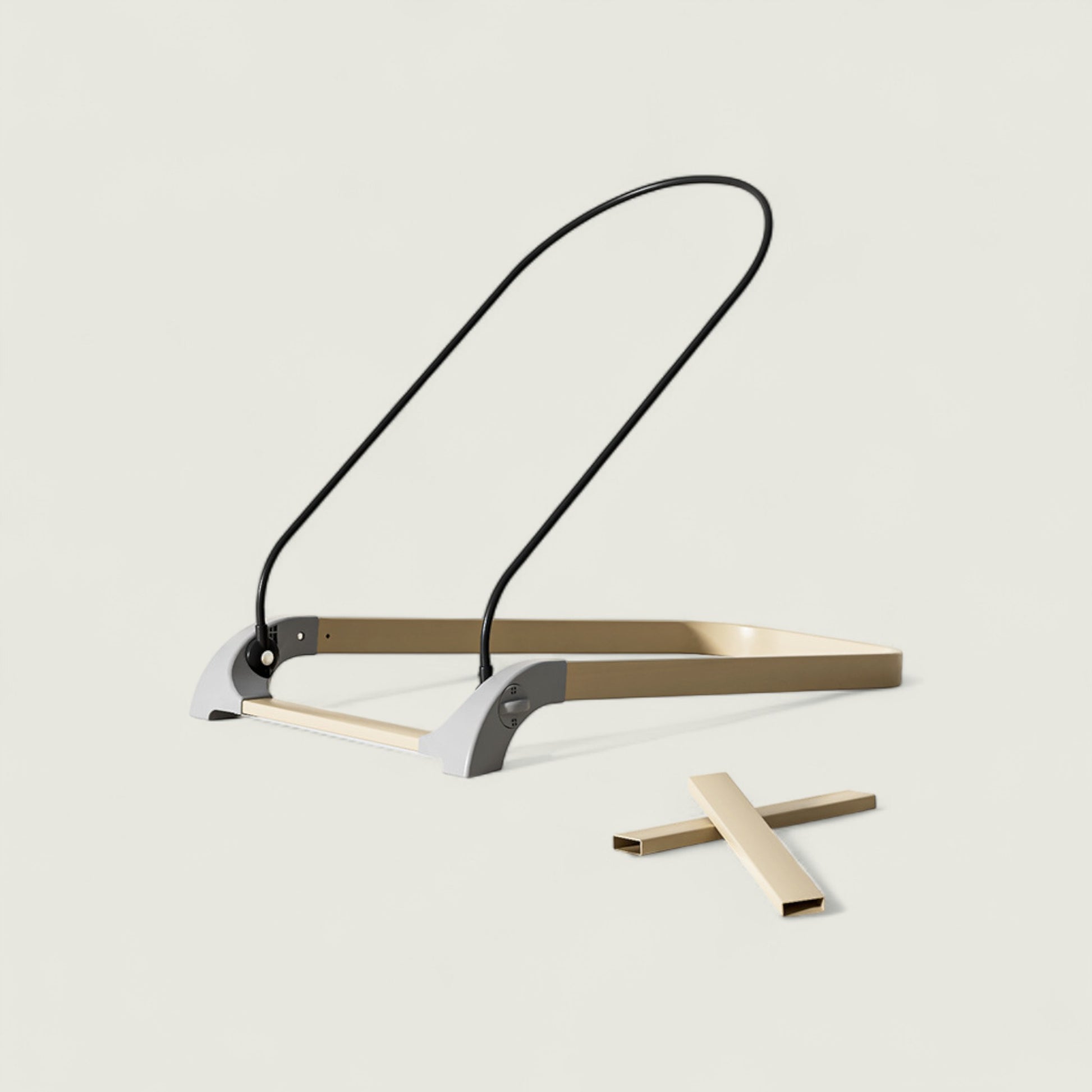 Modern folding chair with a black strap on a light gray background