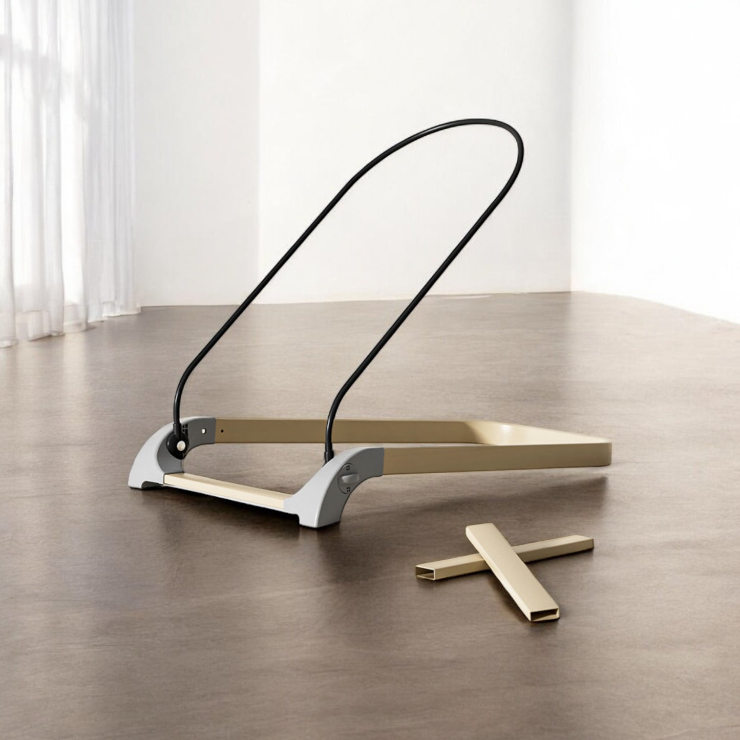 Modern floor lamp with a black curved arm and gold base on a wooden floor.