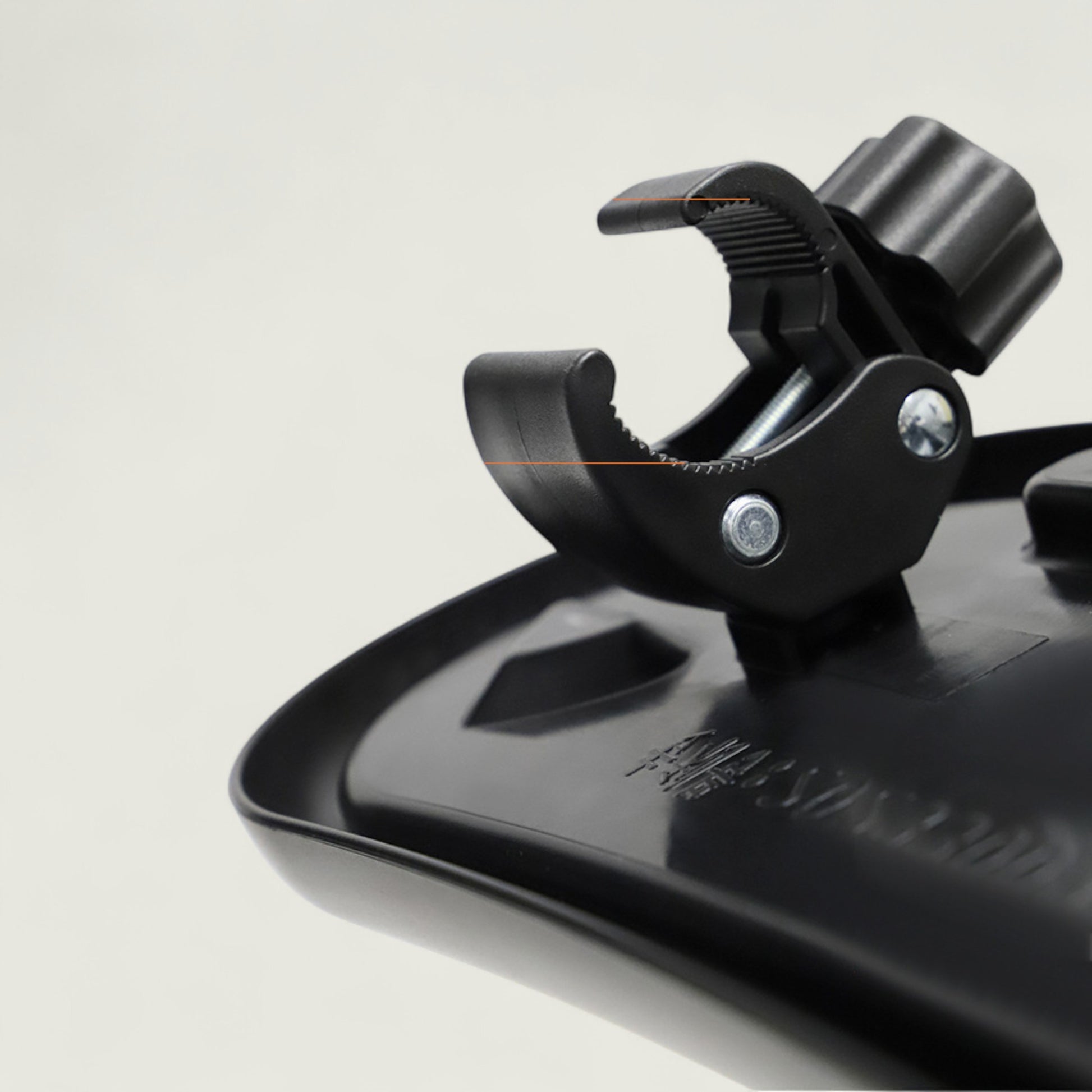 Close-up of a black metal clip on a white background