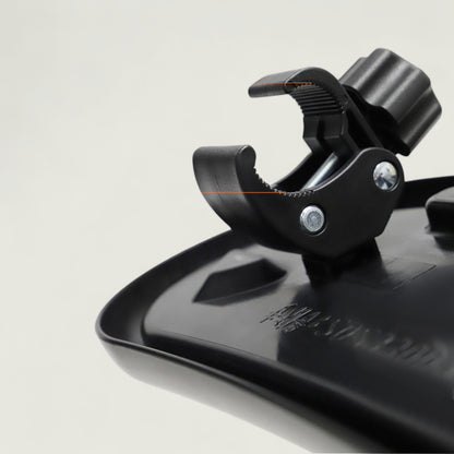 Close-up of a black metal clip on a white background