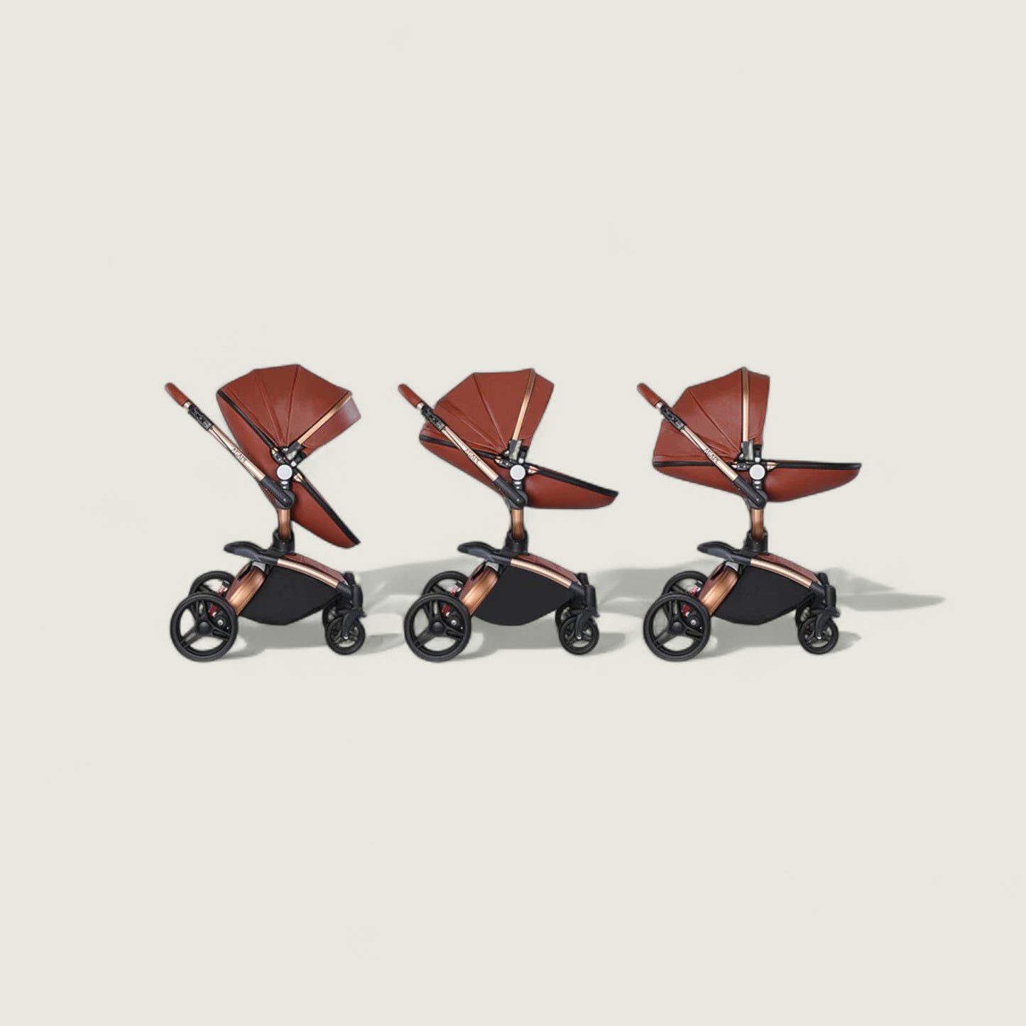 Three baby strollers with brown seats and black frames on a beige background