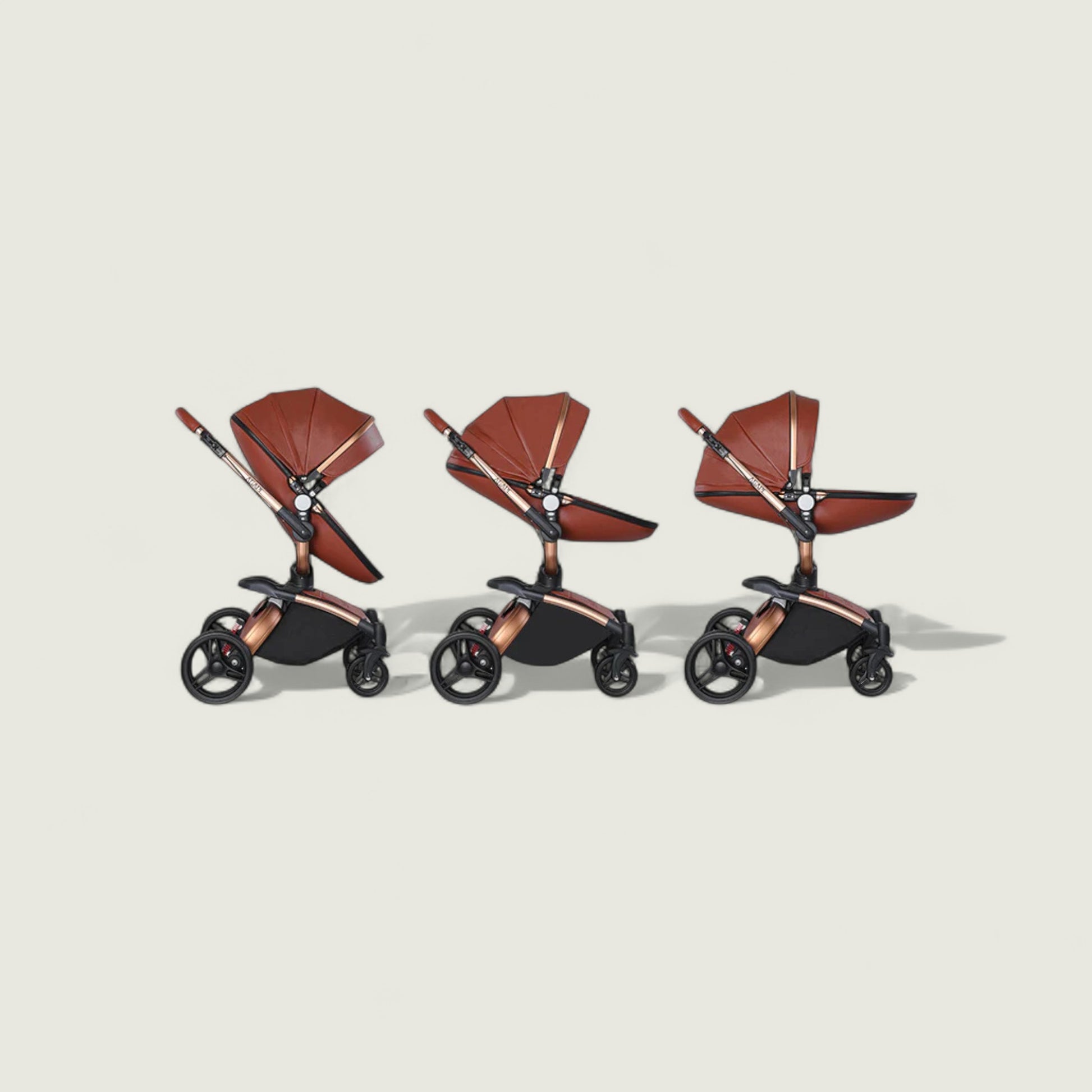 Three baby strollers with brown seats and black frames on a beige background