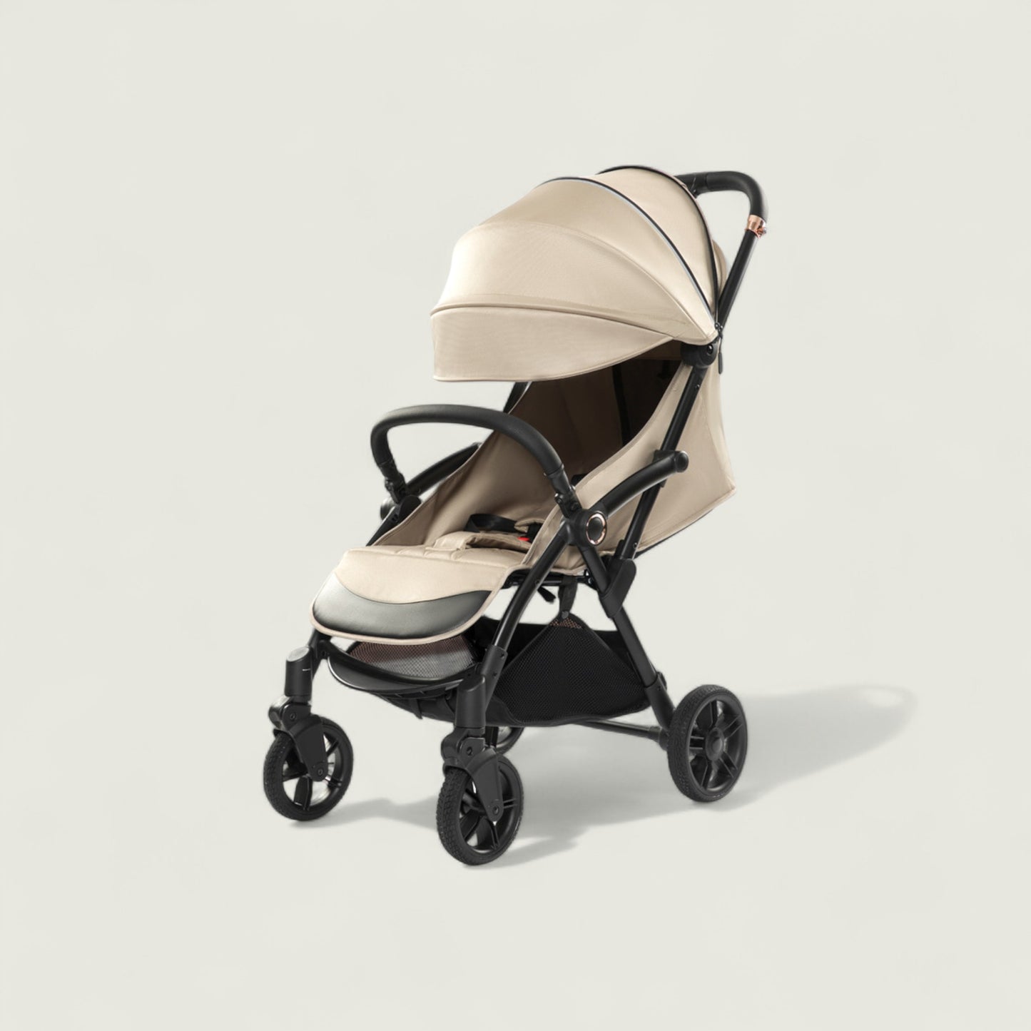 Beige and black stroller on a light gray background