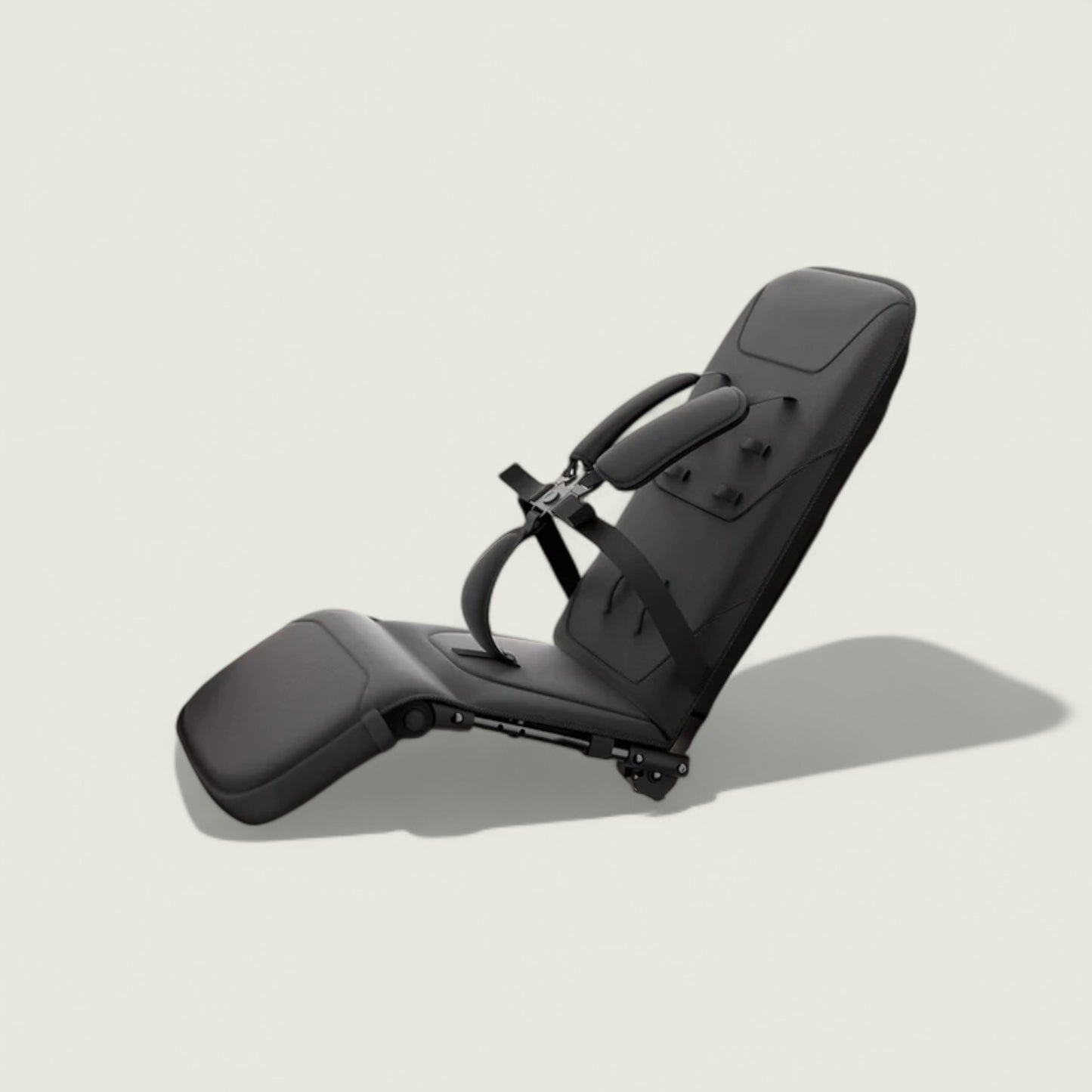 Black car seat with adjustable headrest on a light gray background