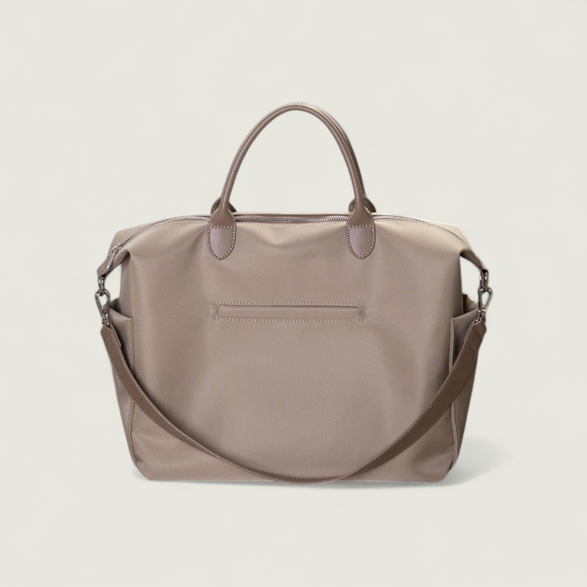 Brown handbag with a shoulder strap on a light beige background