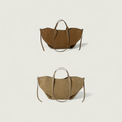 Two brown handbags on a light beige background