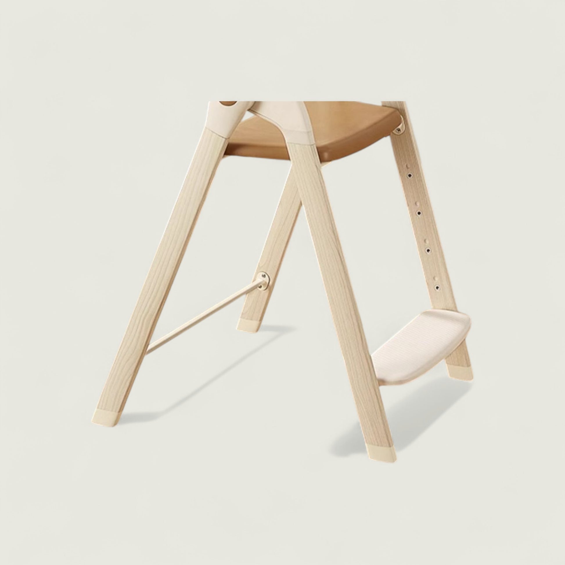Wooden stool with a white cushion on a light beige background