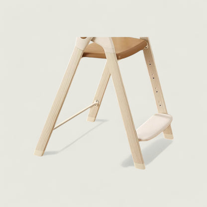 Wooden stool with a white cushion on a light beige background
