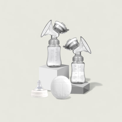 Breast pump with bottles and accessories on a light gray background