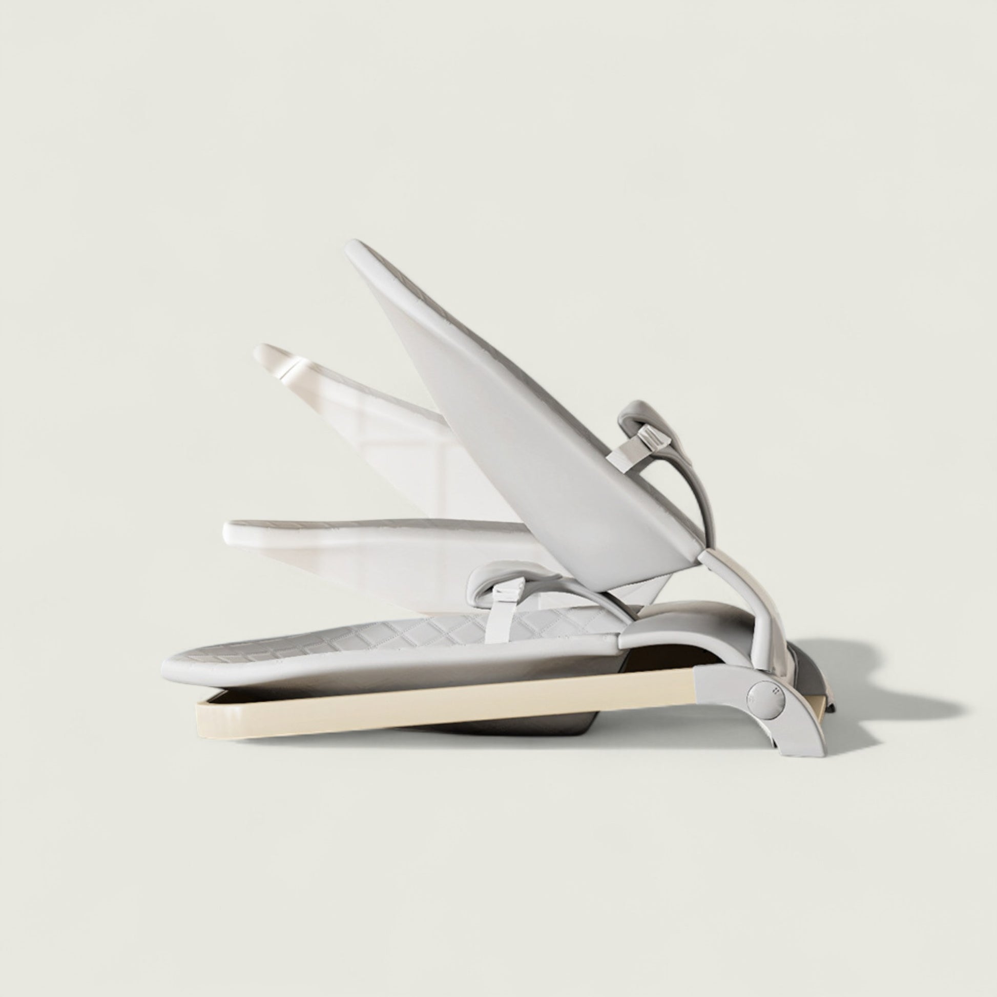 White hair straightener on a light gray background