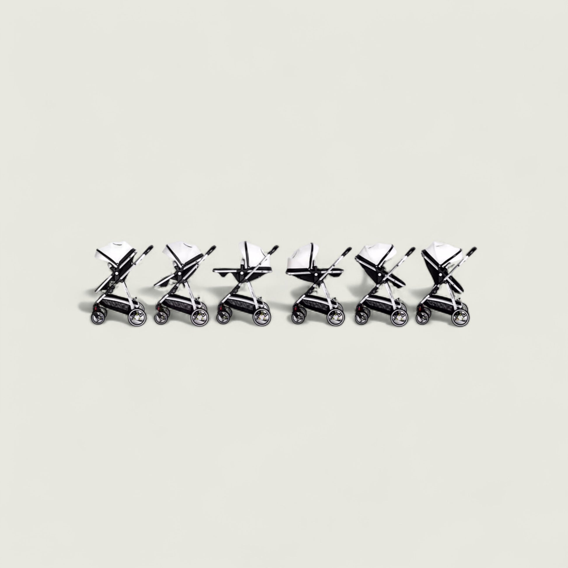 Set of six small metal stroller models arranged in a row on a light gray background