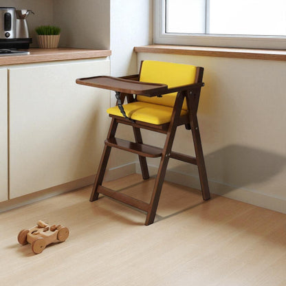 Wooden high chair with yellow cushion in a kitchen setting