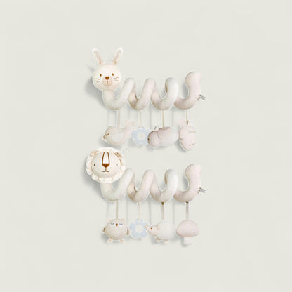 Children's mobile with hanging animal toys on a light gray background