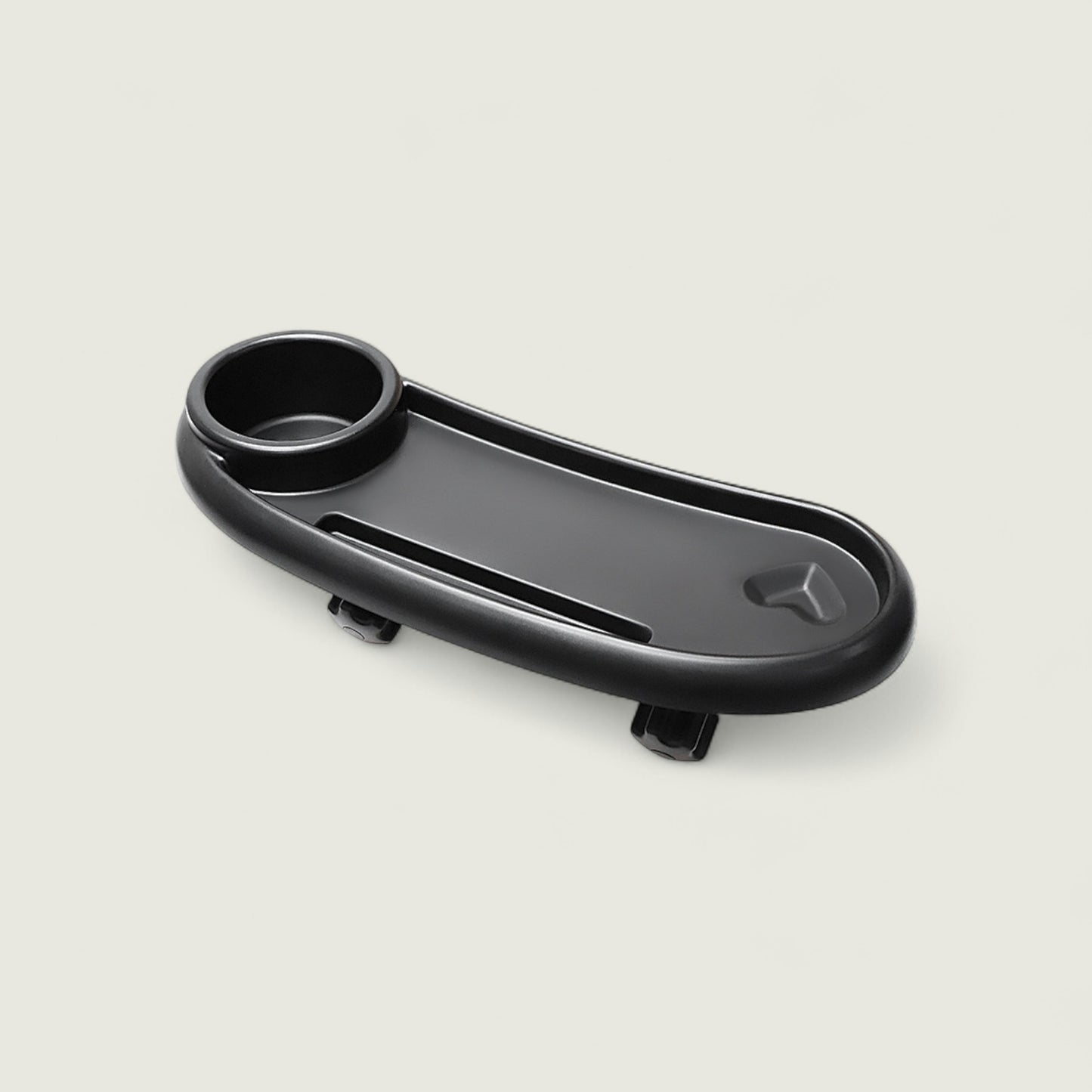 Black car cup holder tray on a light gray background