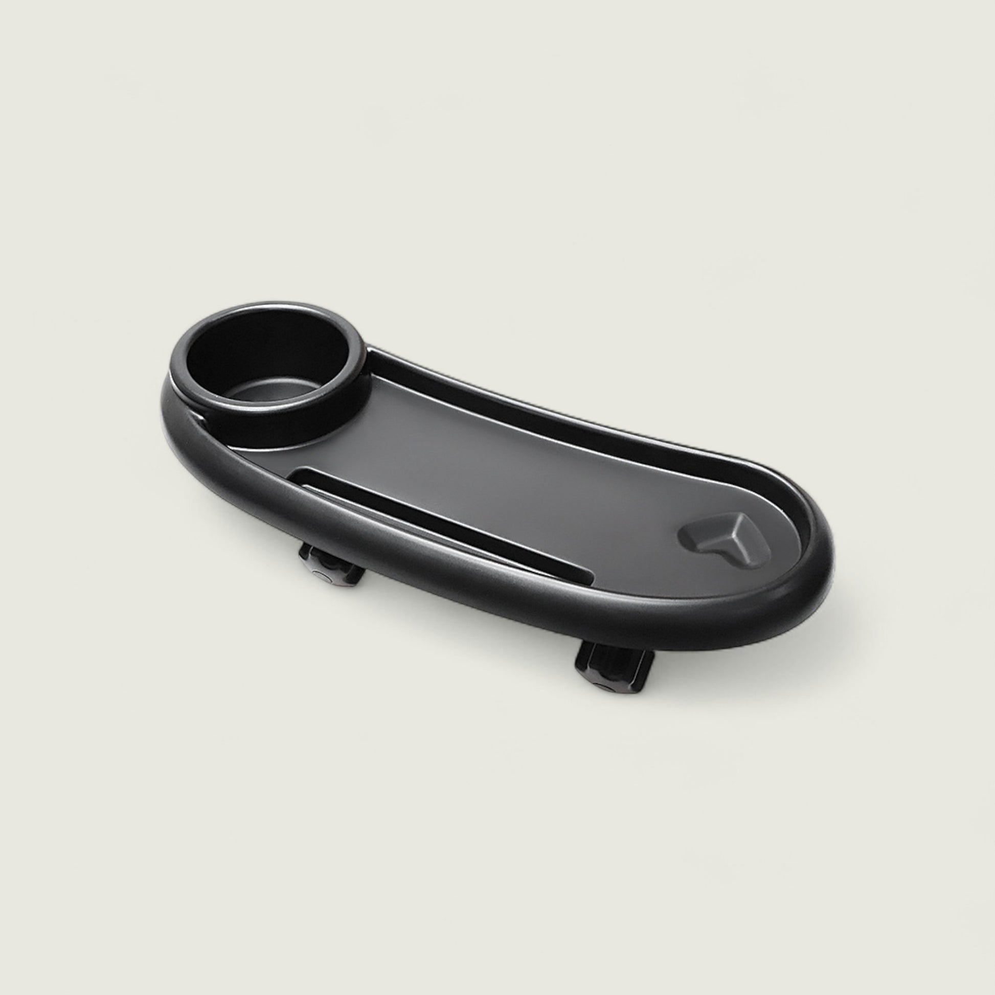 Black car cup holder tray on a light gray background