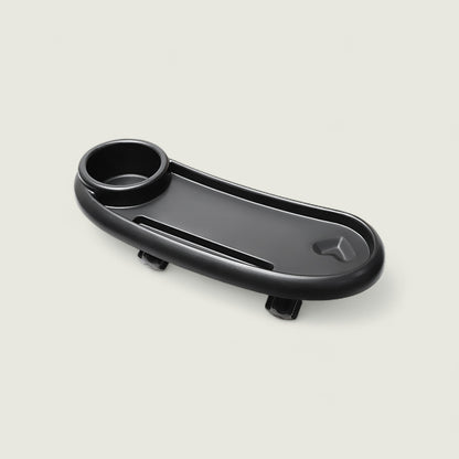 Black car cup holder tray on a light gray background