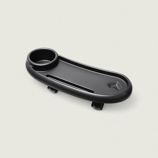 Black car cup holder tray on a light gray background