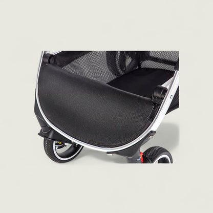 Close-up of a black pet stroller on a light gray background