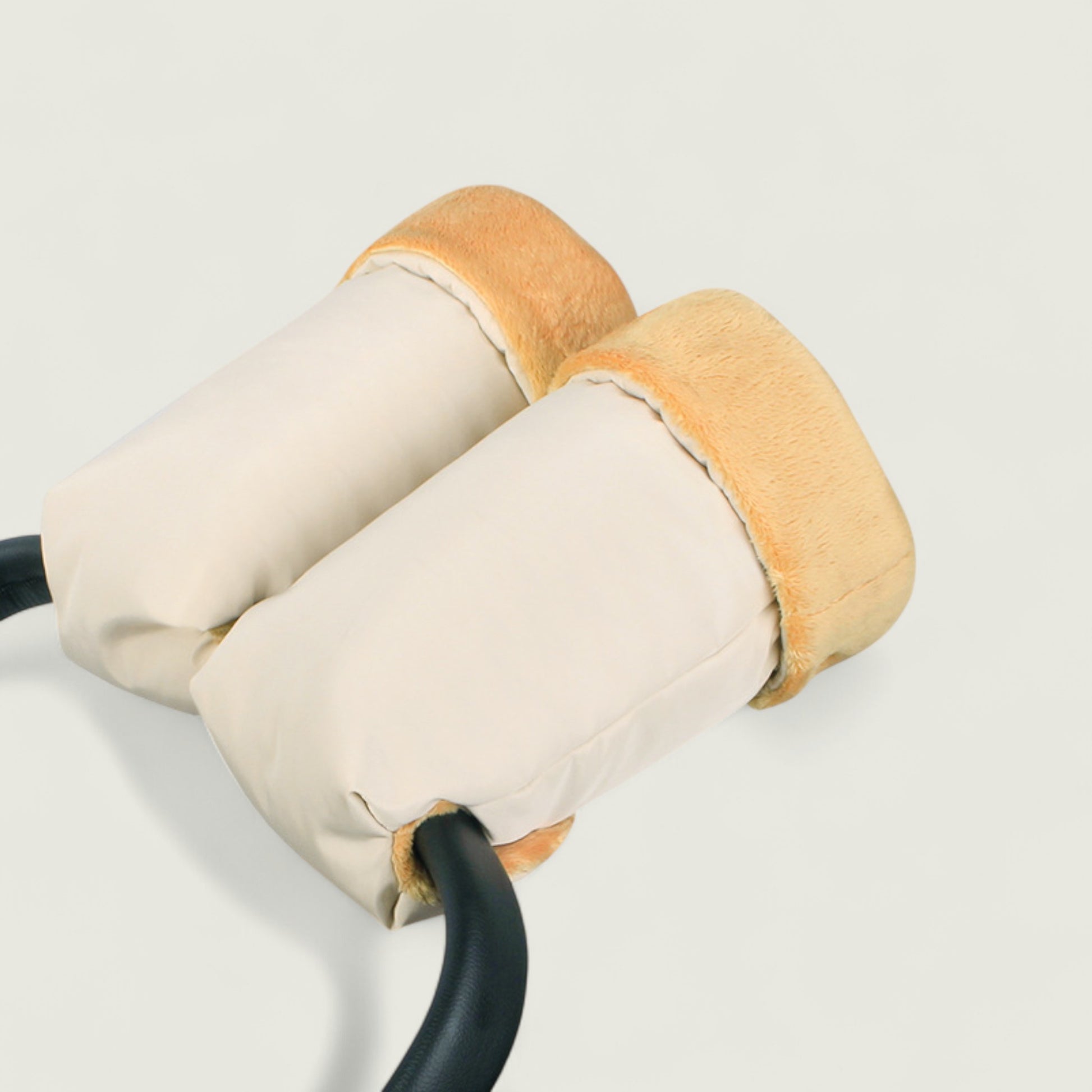 Pair of beige and brown ear muffs on a light gray background