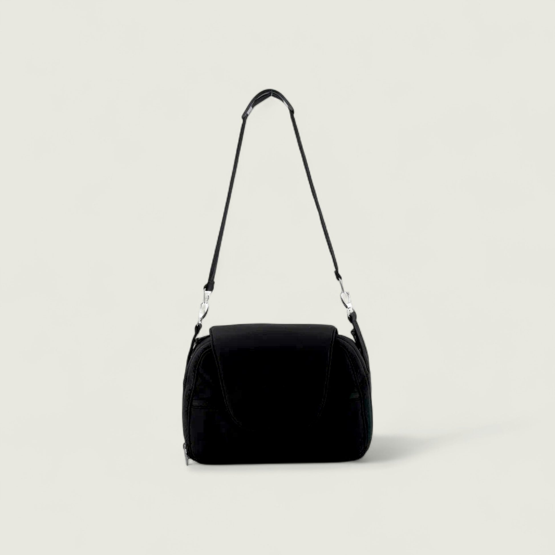 Black shoulder bag on a light gray background