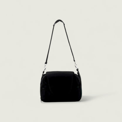Black shoulder bag on a light gray background