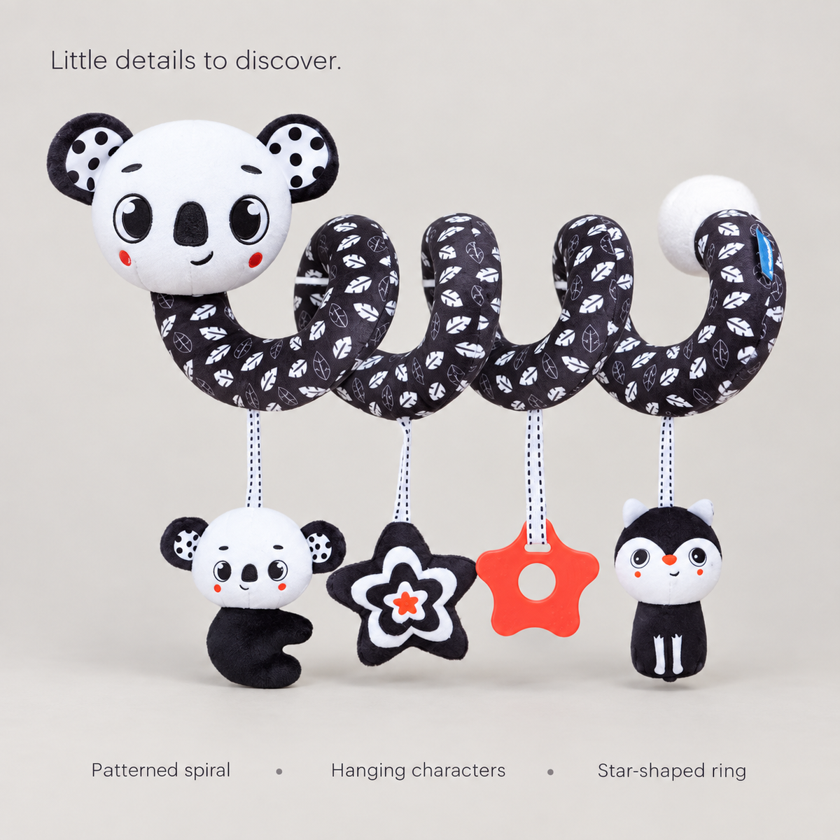 Koala spiral toy showing its patterned spiral, hanging characters and star-shaped ring.
