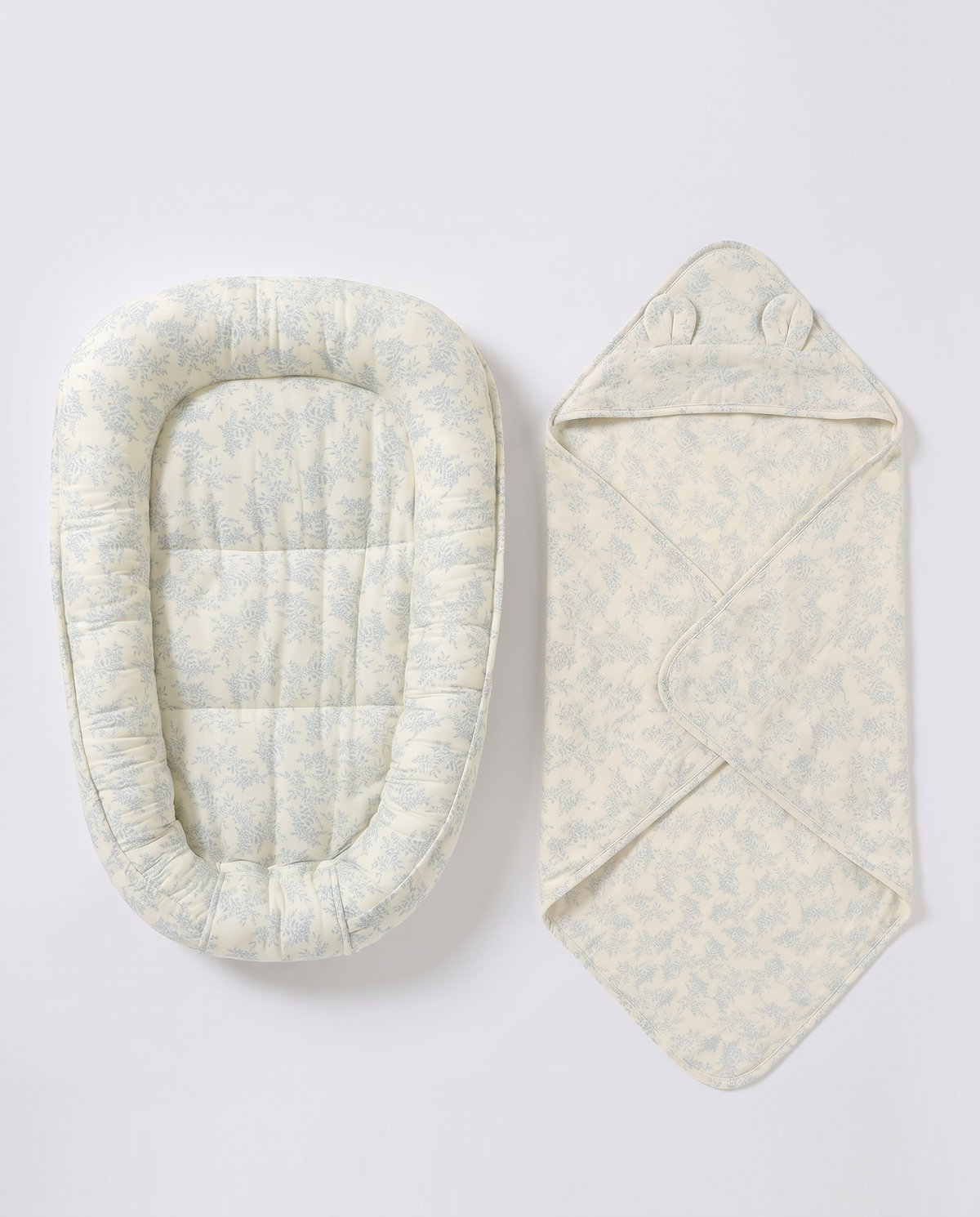Green Leaves muslin nest and matching hooded blanket, shown separately
