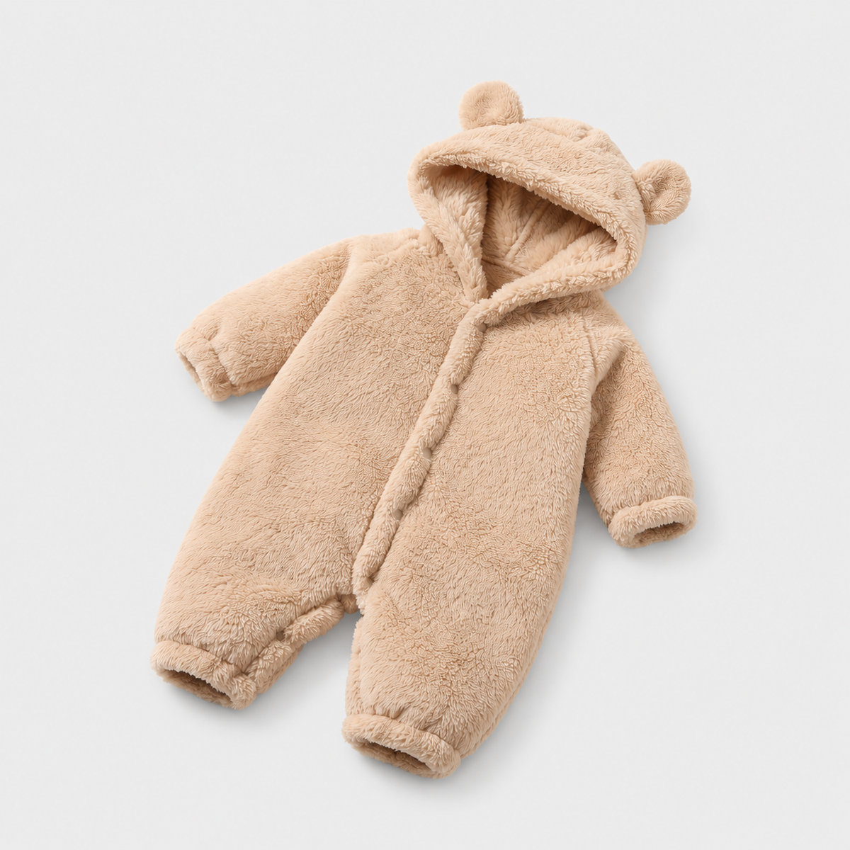 Beige plush baby hooded romper with bear ears, studio product view