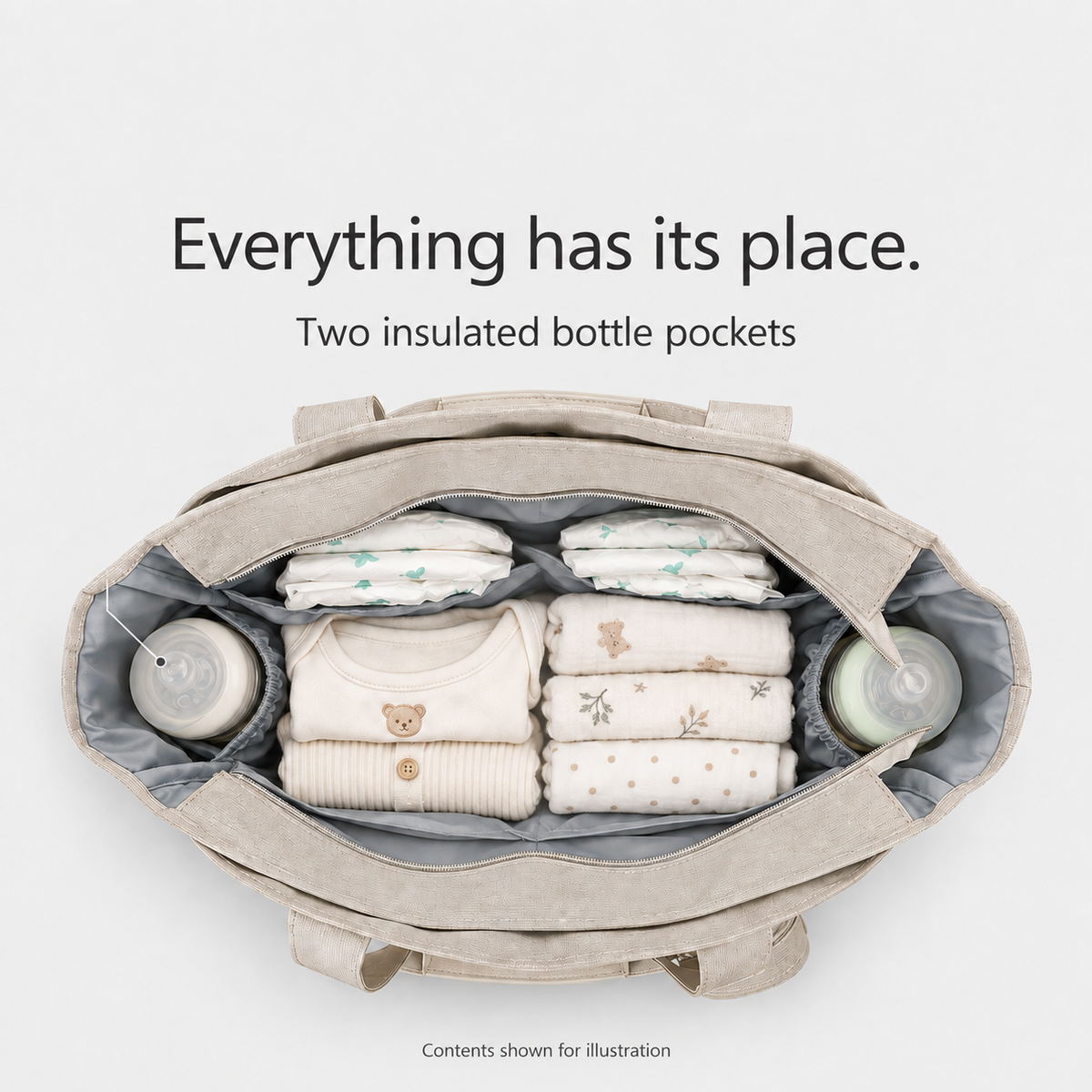 Open diaper tote with two insulated bottle pockets; contents shown for illustration