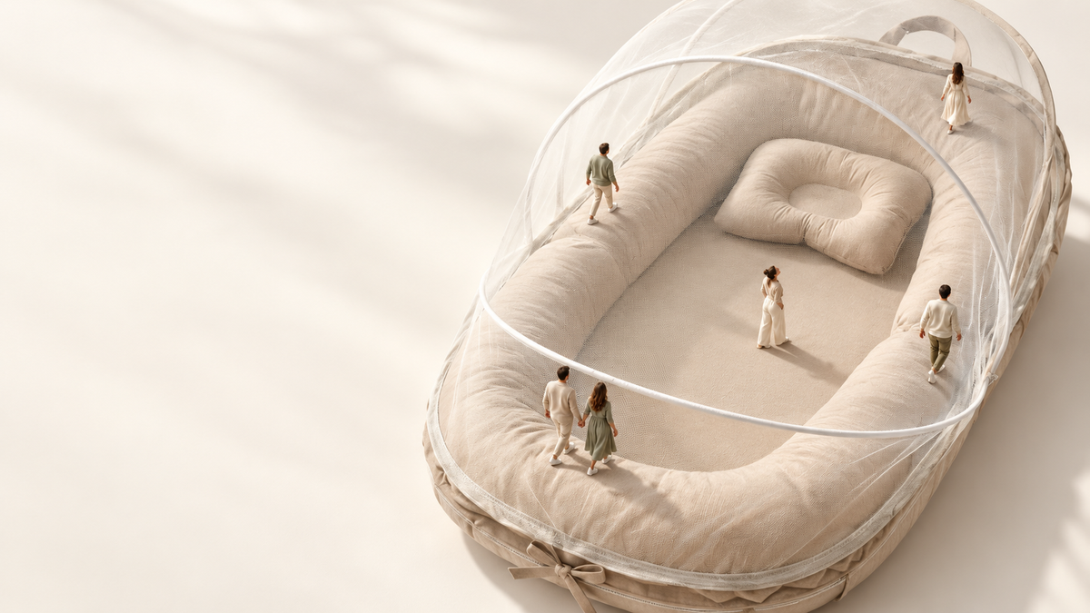 Miniature people exploring a cream TravelNest lounger — creative macro world