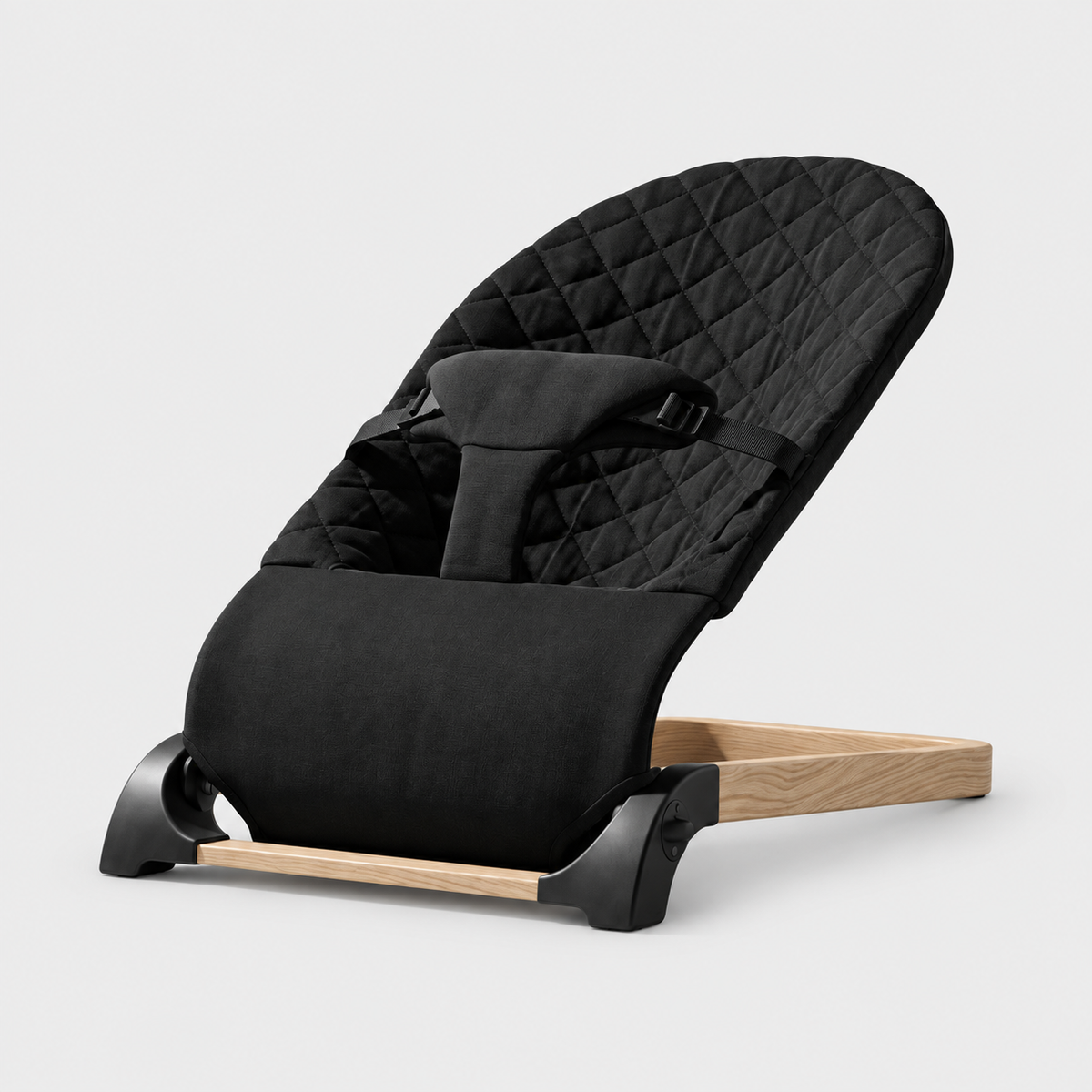 Baby Bouncer — Black, quilted seat and woodgrain base on a neutral studio background