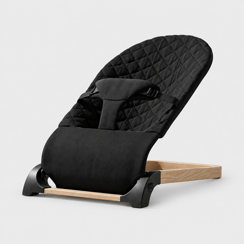 Baby Bouncer — Black, quilted seat and woodgrain base on a neutral studio background
