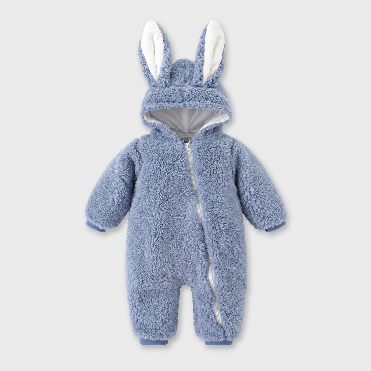 Cozy Bunny blue fleece romper with long bunny ears and diagonal zip on a light grey studio background
