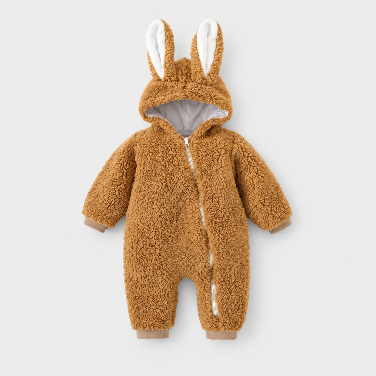 Cozy Bunny brown fleece romper with long bunny ears and diagonal zip on a light grey studio background