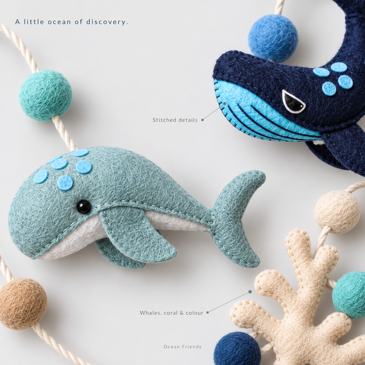 Ocean Friends hanging toy close-up showing whale shapes, stitched details, coral and coloured balls.