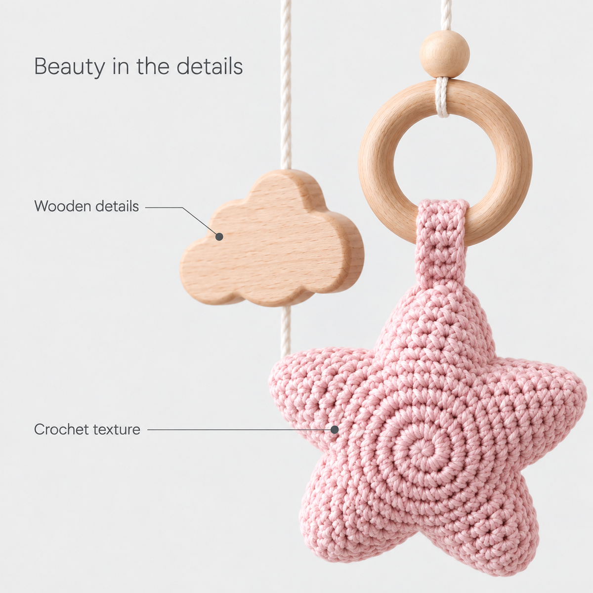 Moonveil pink mobile: crochet star texture and wooden details close up