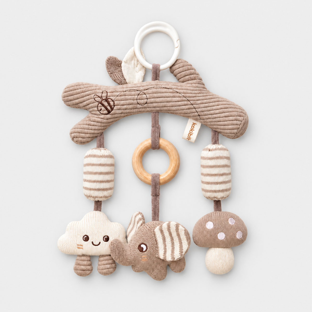 Elephant hanging toy with cloud and mushroom, arranged on a light grey studio surface
