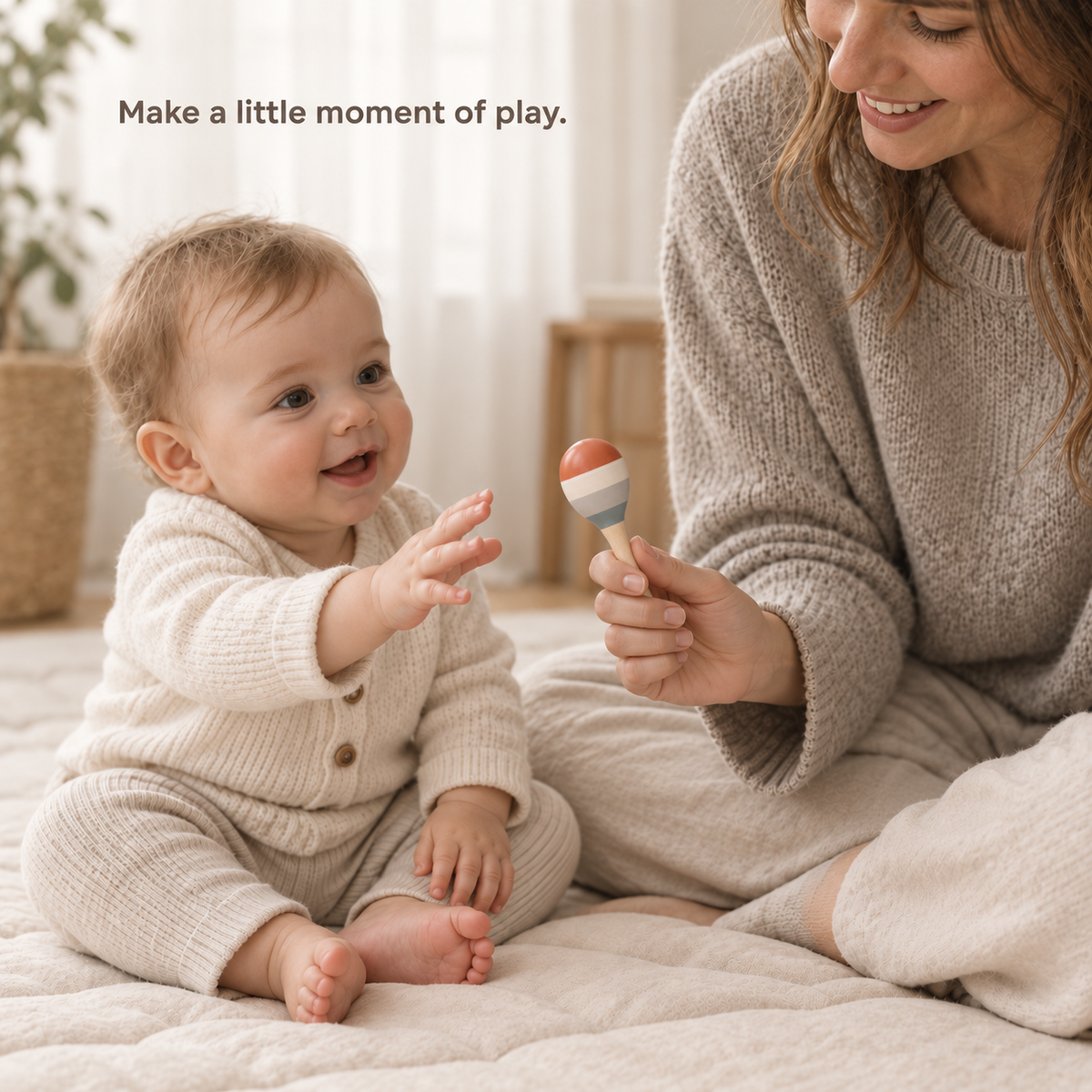 Mother holding a small wooden maraca during play with her awake baby.