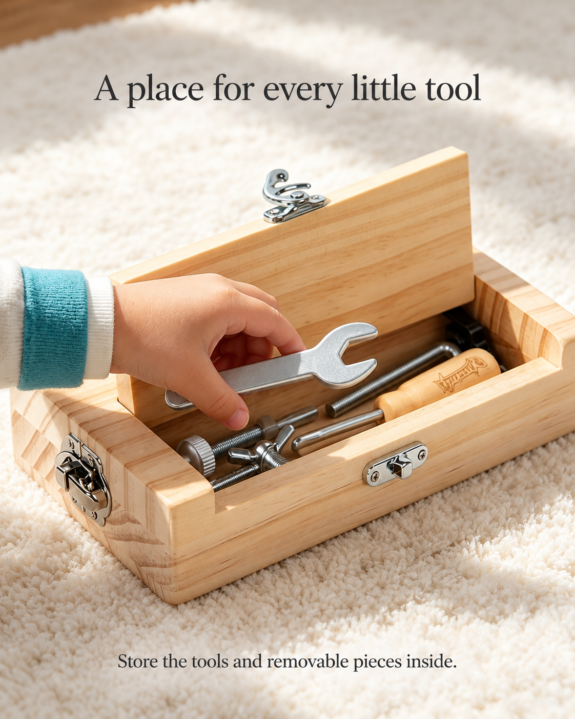Open wooden toolbox with tools and removable parts stored inside