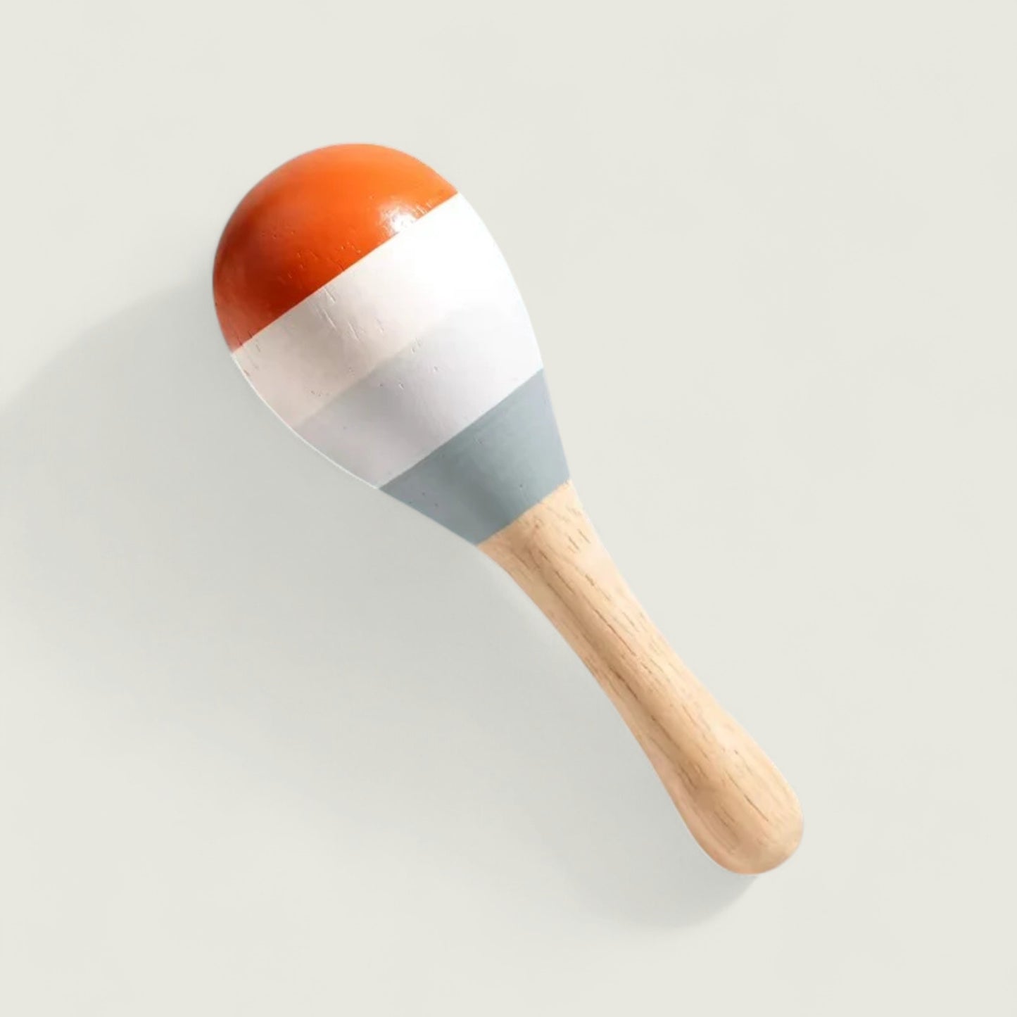 Colorful maraca on a light gray background